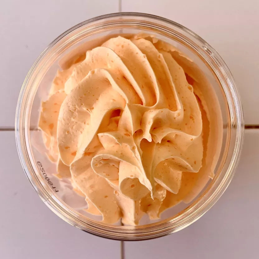 Chantilly de douche exfoliante à la poudre de noyau d'abricot 100 g Mangue